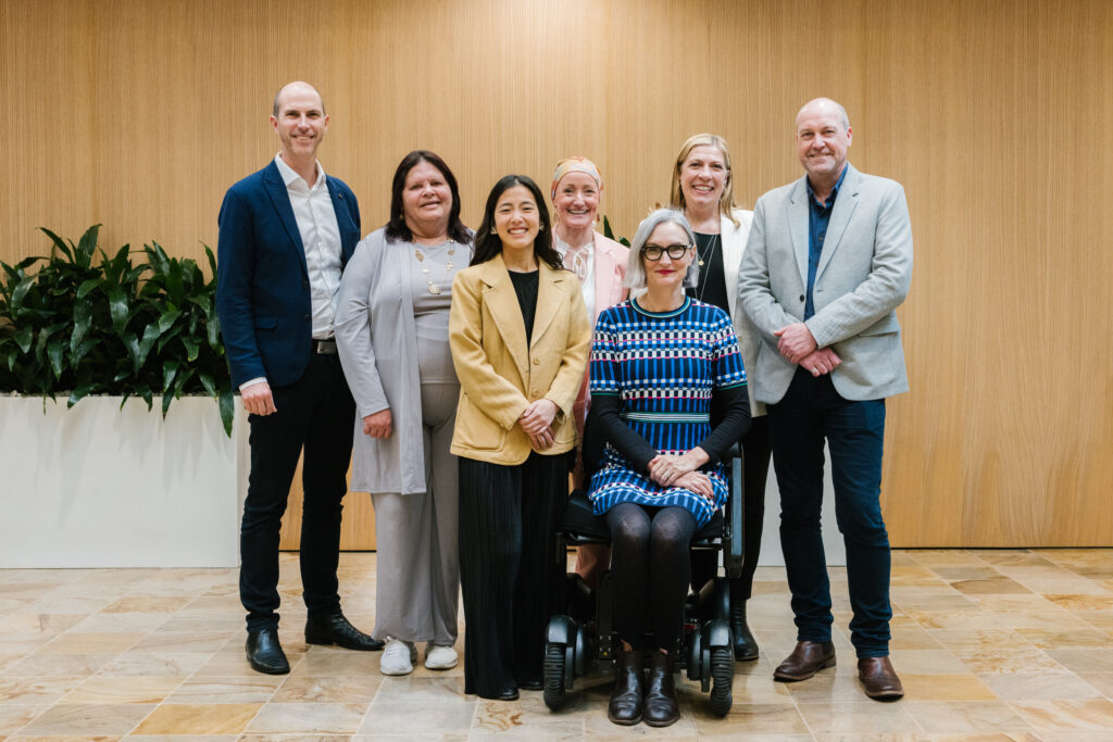 7 people posing for photo. BankSA employees with grant recipients. 